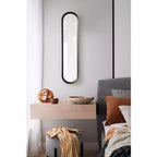 Specchio da parete a capsula in metallo nero 10"x40"